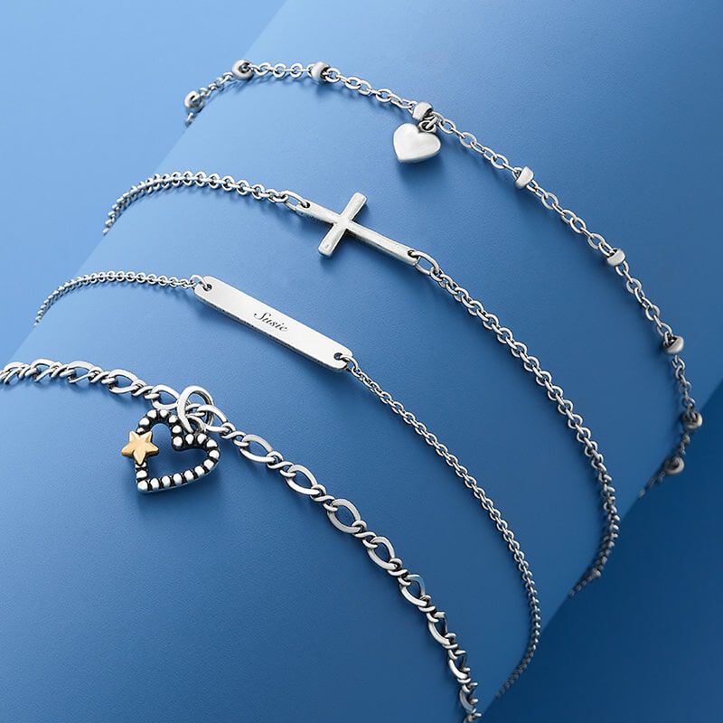 Sterling silver anklets on a blue background
