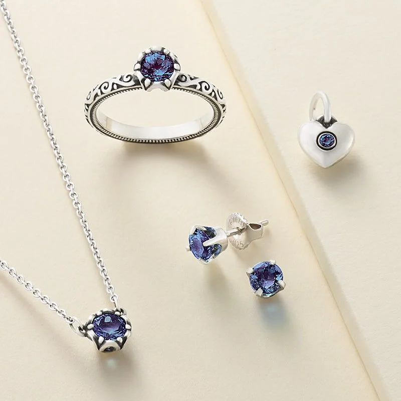 Gemstone ring, earrings, charm and necklace