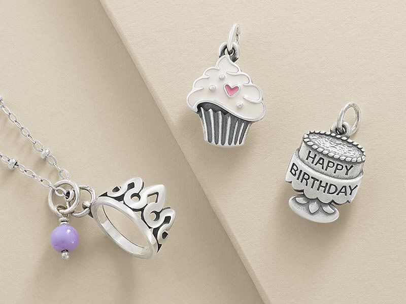 Sterling silver birthday cake and other charms.