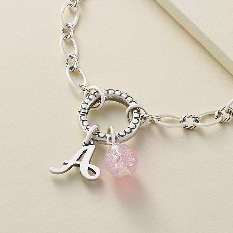 Changeable charm holder with initial charm and colorful accent bead