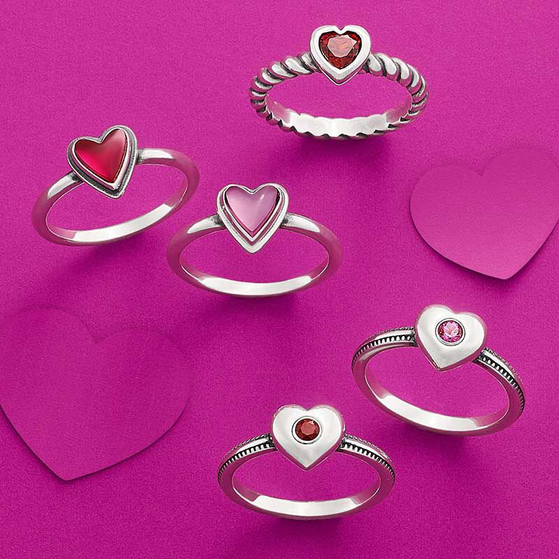 Heart rings in sterling silver with gemstones in the center.