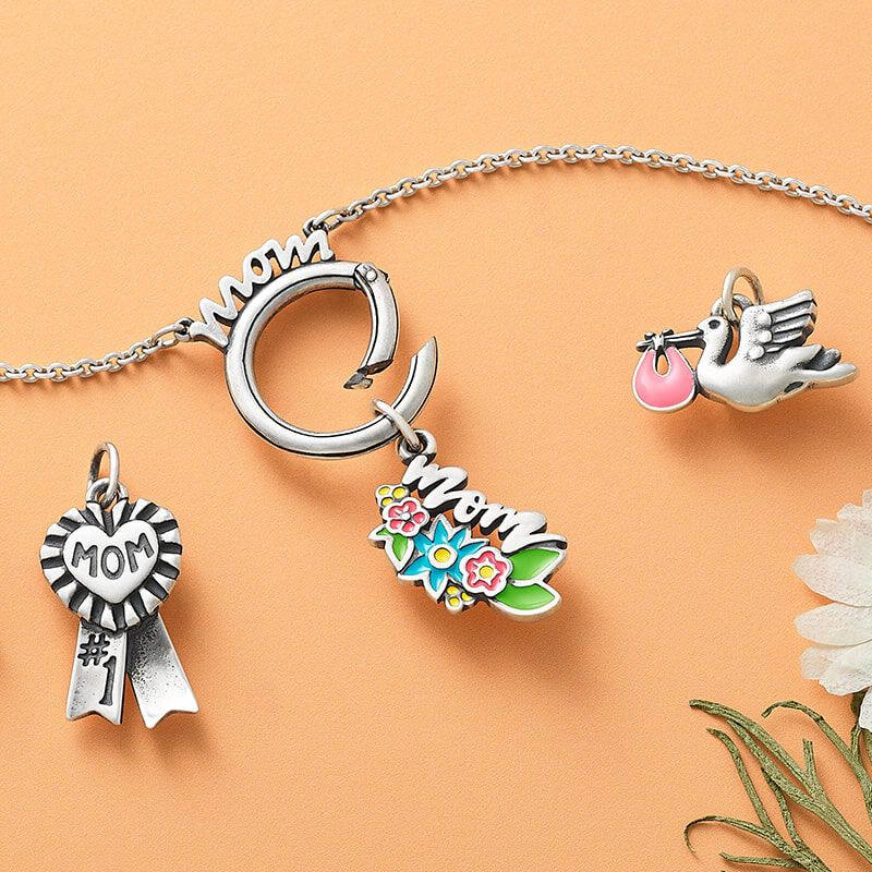 Sterling silver and enamel Mother’s Day charms.