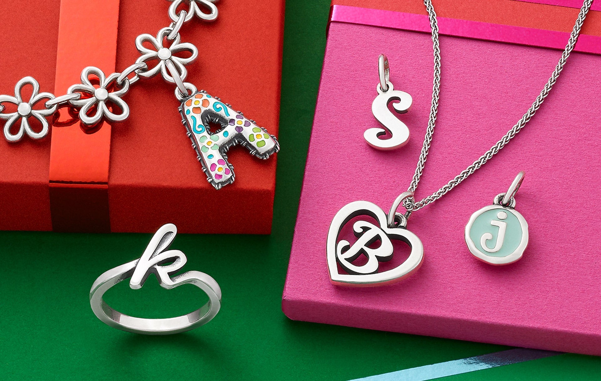 Christmas charms in silver, gold, glass and enamel.