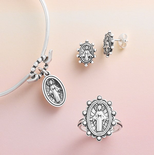 religious charms on necklaces and earrings