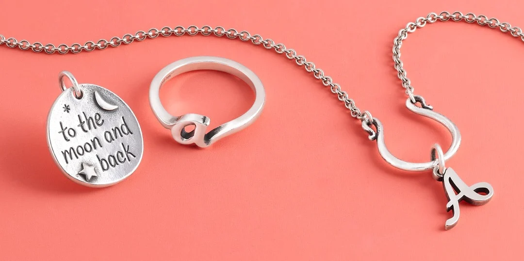  Sterling silver initial necklace, ring and charm.
