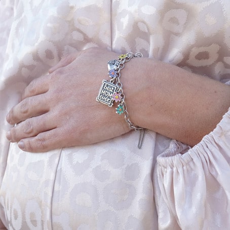 Pregnant woman with sterling silver bracelet.