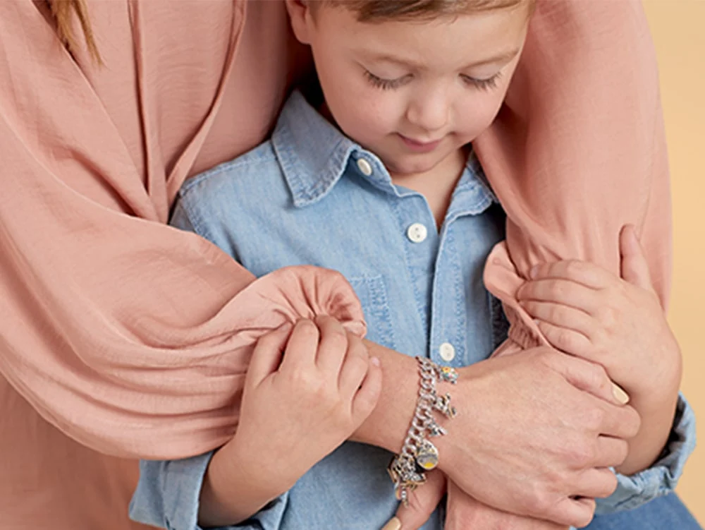 Mother with full charm bracelet and son