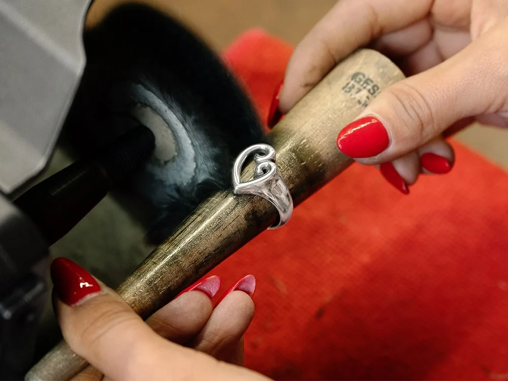 Associate polishing sterling silver Mother's Love Ring