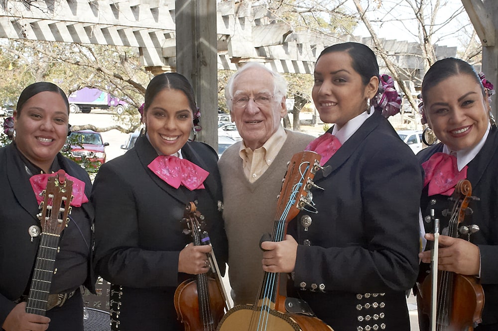James Avery stands with a mariachi band for hi big day