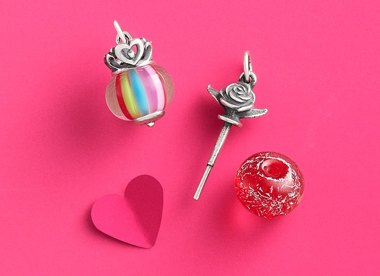Rose finial with rose glitter and princess crown rainbow stripe.